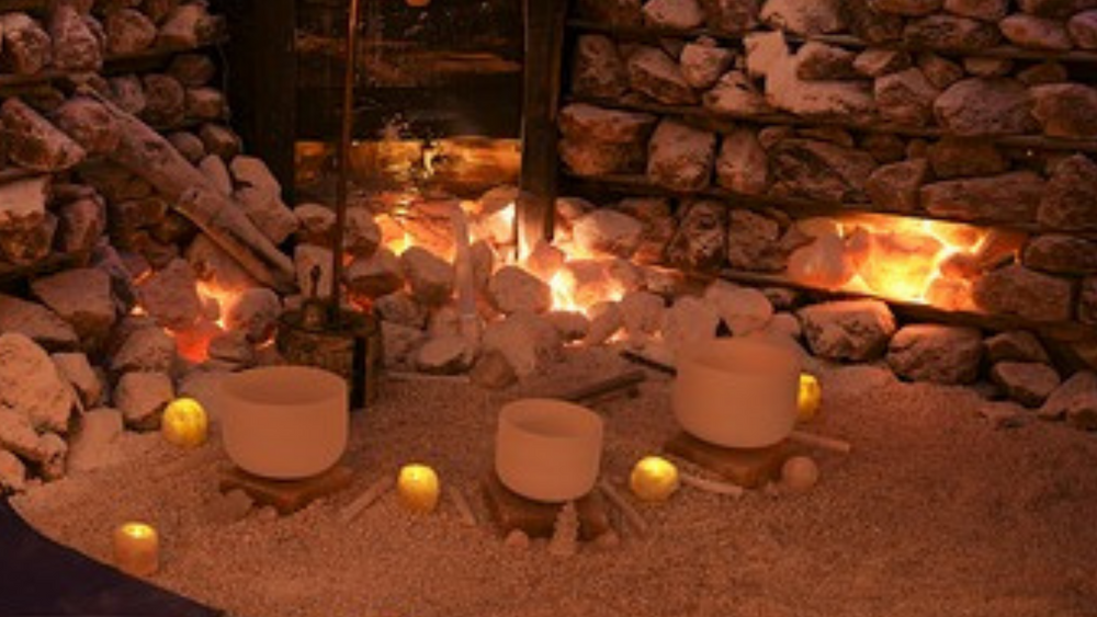 Candles. Crystal singing bowls inside a cave.