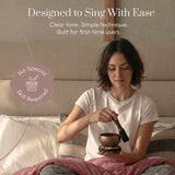 Playing the Golden Harmony singing bowl with the wooden striker: designed to sing with ease