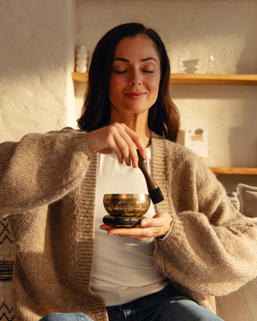 A warm evening room with a singing bowl set nearby